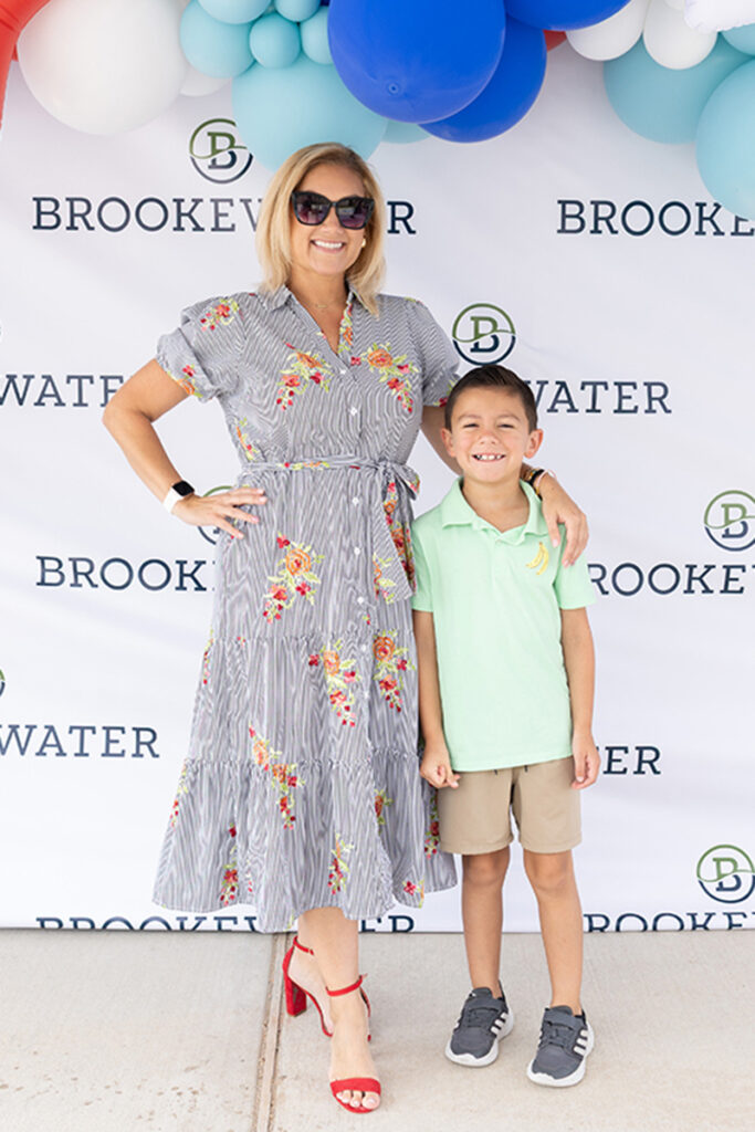 Woman and young boy smiling at a Brookewater event in a master-planned community.