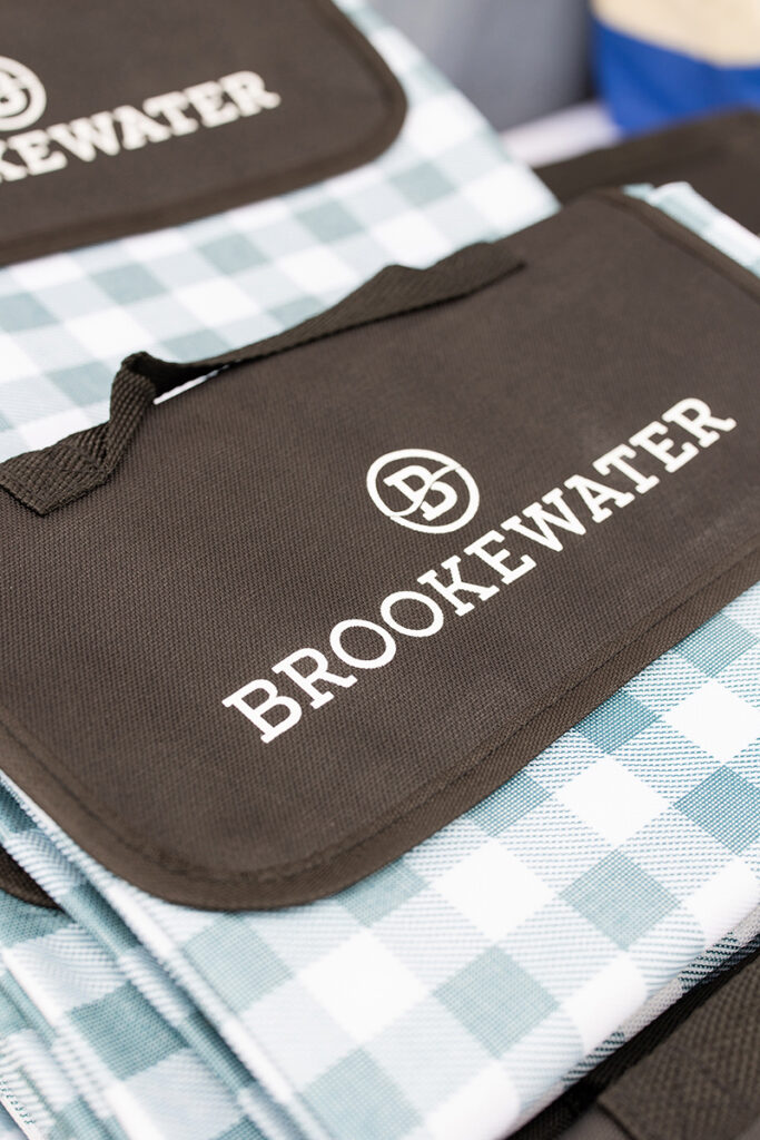 Folded picnic blanket with BROOKEWATER logo, perfect for outings near Richmond TX.