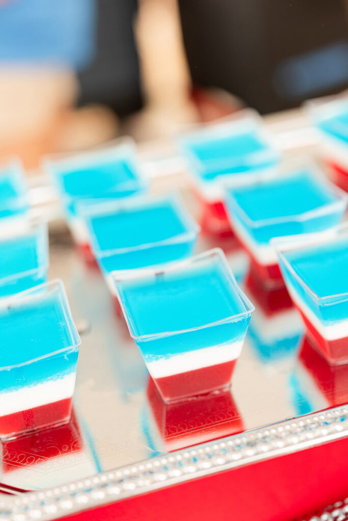 Small cups of layered blue, white, and red gelatin desserts in Brookewater near Richmond TX.