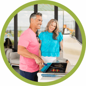 Man grills outdoors near Richmond TX, smiling in a master-planned community setting.